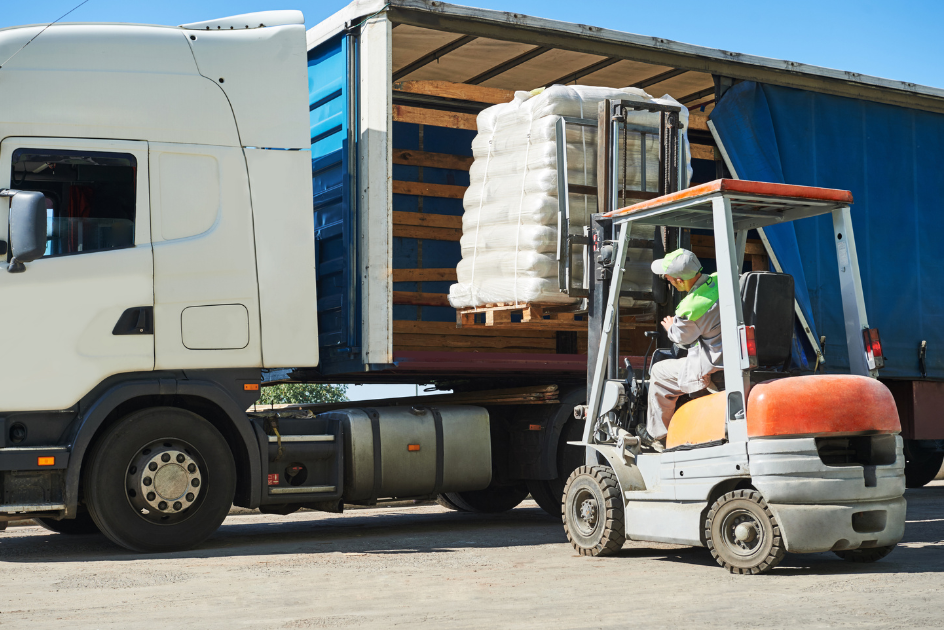 forklift loading a semi-truck